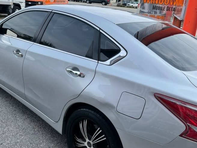 Silver sedan after scuff removal